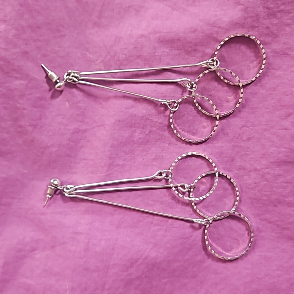 Lightweight 3.5" triple drop shiny, sparkly silvertone post earrings